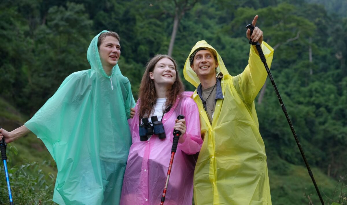 people hiking in the rain in ponchos
